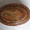 Round Kashmiri papier mache jewelry box with hand painted Persian paisley design and lacquered finish