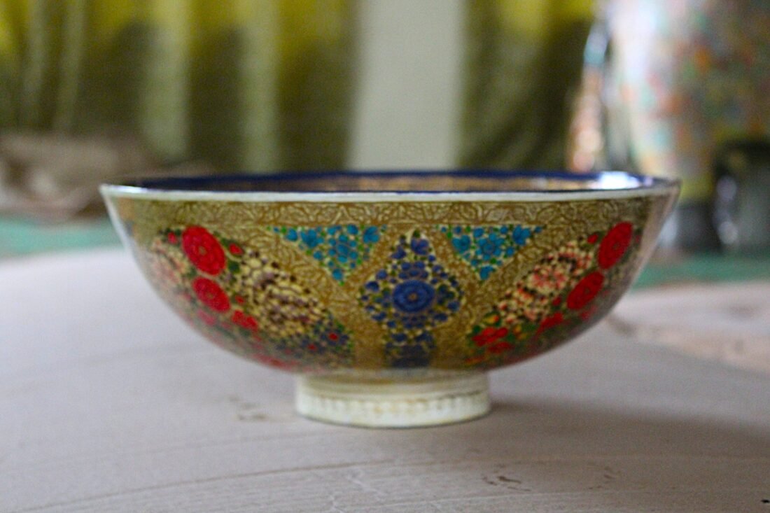 Hand painted Kashmiri papier mache bowl with floral design and blue gold interior